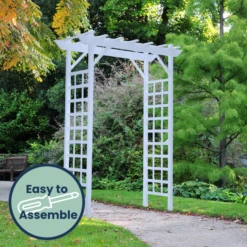 Classic White Vinyl Lattice Arbor – Elegant Flat-Top Garden Entrance for Climbing Plants -The Birdhouse Chick vinyl lattice arbor in garden